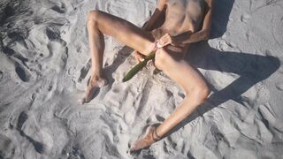 Amatuer Nudist Youngster Rides her Tight Cunt with a Giant Cucumber on a Public Beach. Ends with a Pee.