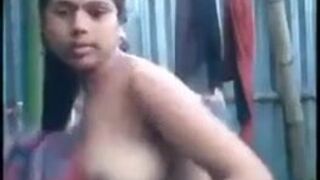 Assamese lady nude bathing.