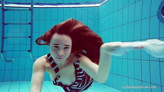 Charming hairy snatch teen Nina in the swimming pool