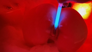 Blue neon enters her twat, engulfing her in red flames.