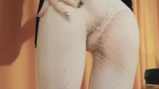 Ravishing whore in a ebony dress twirls her butt in front of the web camera
