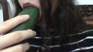 Sucking the cucumber like a big dick