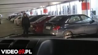 A high school whore gives a bj in car on the parking lot of a shopping mall